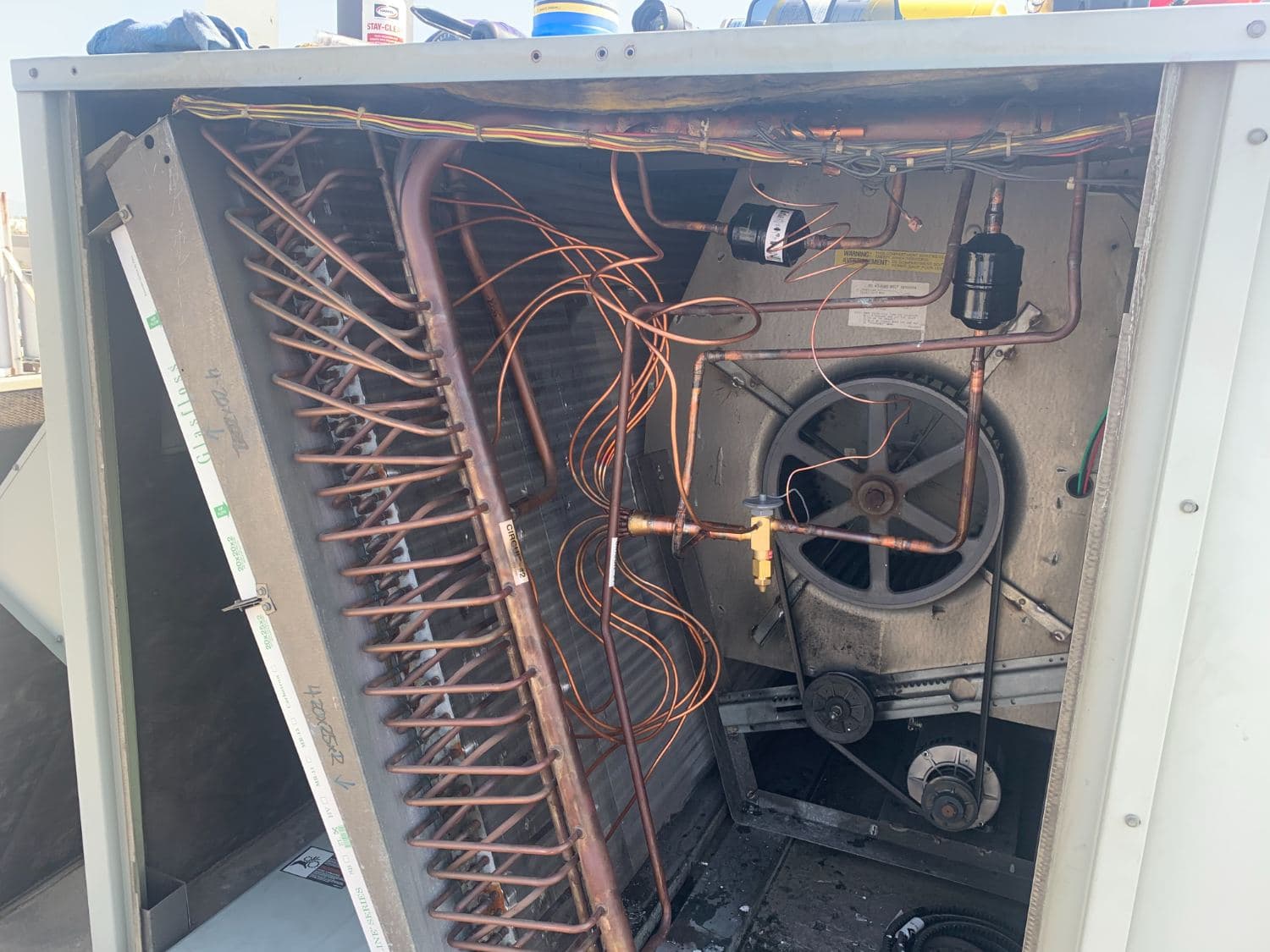 Rooftop unit opened for coil and blower service