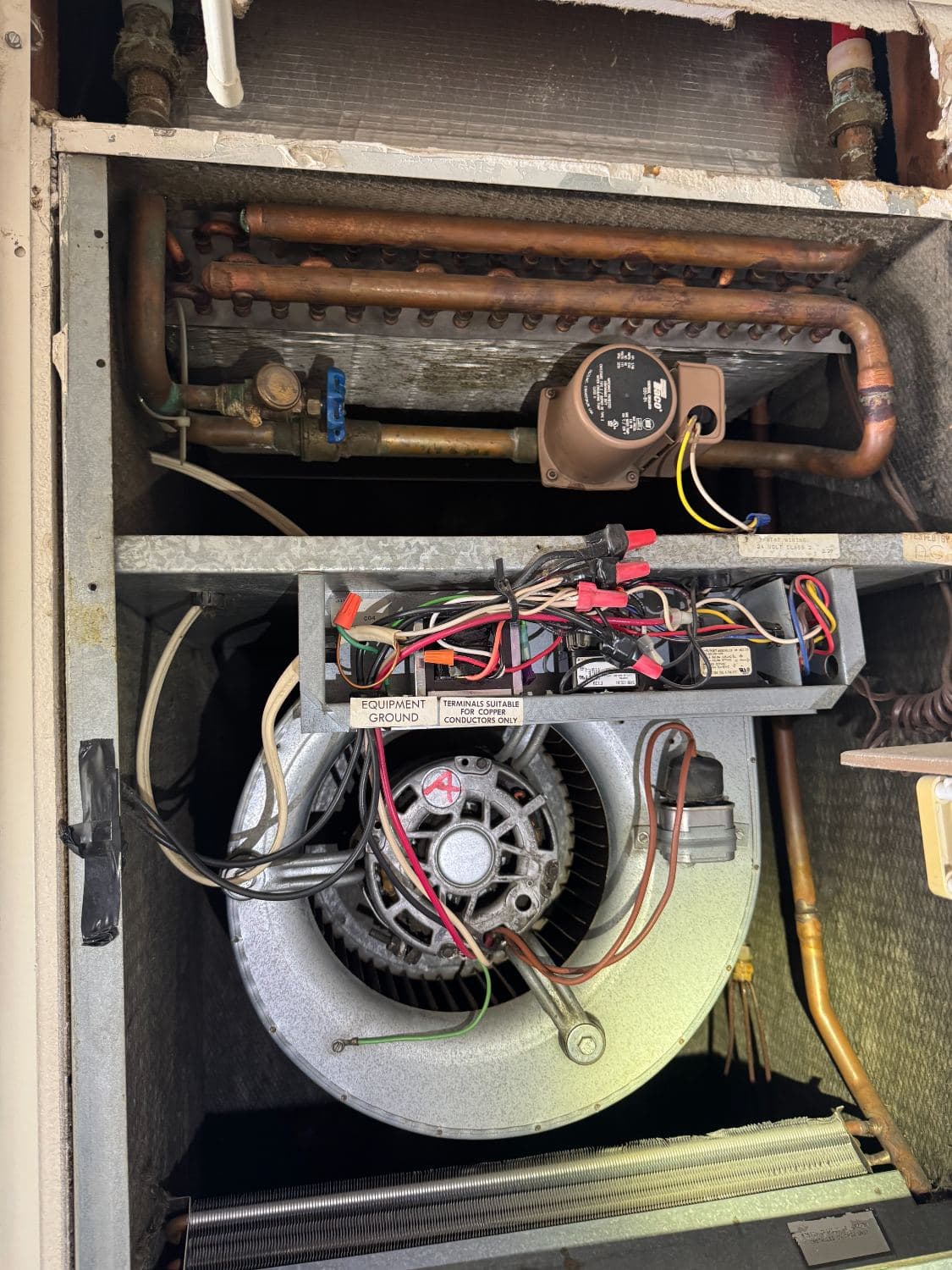 Inside a residential air handler during service